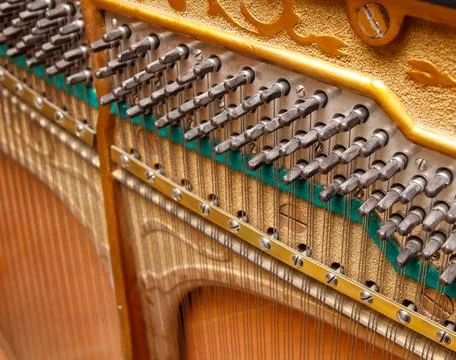 The inside of a piano, with a close up of the strings Stock Photos
