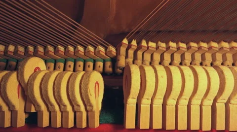 Inside piano hammer hitting string playing music is  Stock Footage 56268942