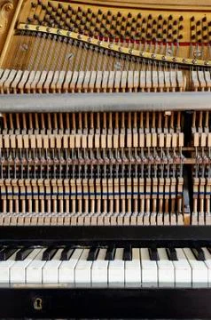 Inside the piano: string, keys and hammers Stock Photos