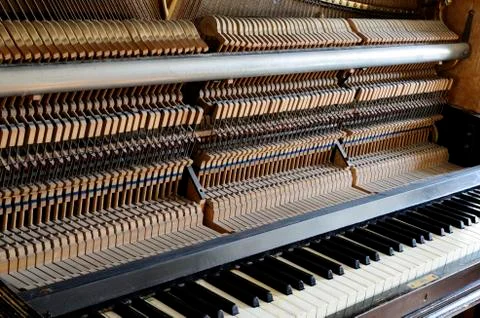 Inside the piano: string, pins and hammers Stock Photos