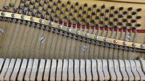 Inside the piano: string, pins, keys and hammers Stock Footage 37501094