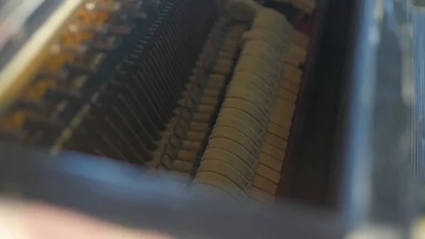 Inside a piano: strings, hammers are playing too slow Stock Footage 93663959