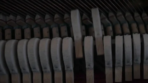 Inside a piano: strings, hammers play Stock Footage 93663957