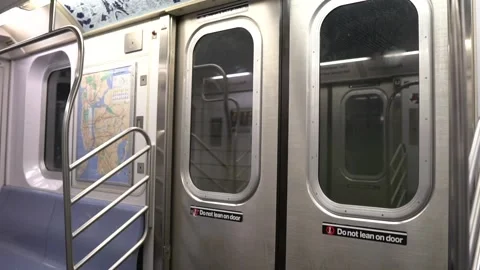 Inside POV of subway door approaching stop in NYC Stock Footage 248477299