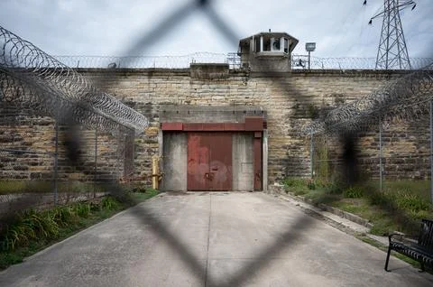 The inside of a prison with a door in front of the door 스톡 사진