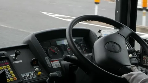 Inside public transportation bus view to steering wheel while bus driver is.. 스톡 동영상 329672029