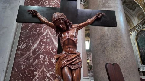 Inside a quiet church, a dramatic sculpture of the Crucifixion of Jesus Stock Footage 320400400
