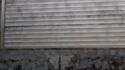 Inside a relentless car wash with a menacing approaching bar blower Stock Footage 173477092