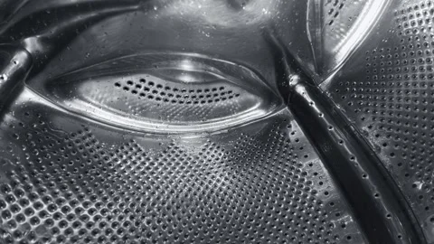 Inside a Rotating Washing Machine Drum with Water Spraying Stock-Footage 332907879