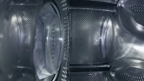 Inside a Rotating Washing Machine Drum with Water Spraying Video stock 332908307