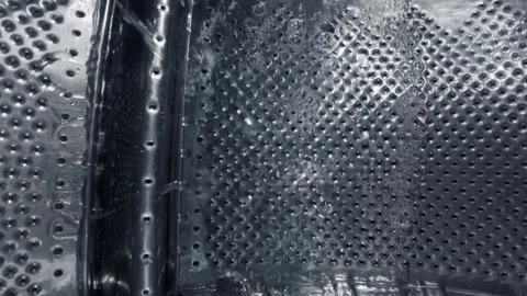 Inside a Rotating Washing Machine Drum with Water Spraying 스톡 동영상 332908624