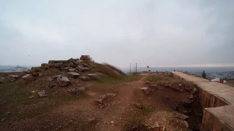Inside Ruins and Barrier Wall of Urfa Castle on Background City Snow and Rain Stock Footage 75410722