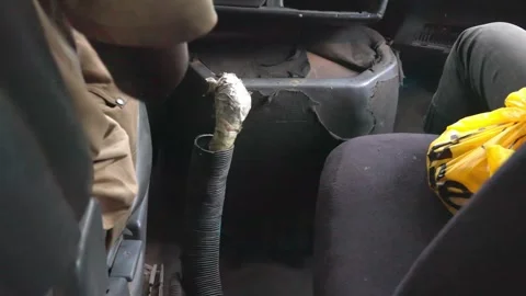 Inside of self-repaired very old car, West Africa Stock Footage 305375450