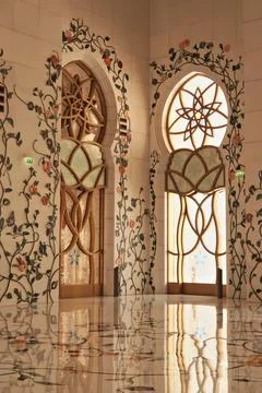 Inside the Sheikh Zayed Grand Mosque, the floor and the wall around the windo Stock Photos