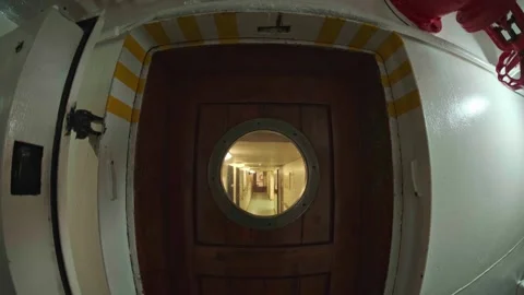 Inside the ship, a door with a porthole Stock Footage 324084442