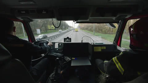 Inside shot a fire truck and firefighters Stock Footage 283140942