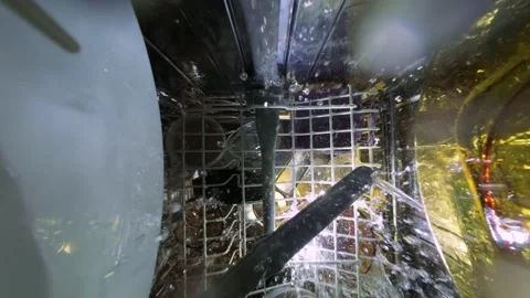 Inside Slow Motion View of Dishwasher with Water Spray and Rotating Arm 库存影片 334309869