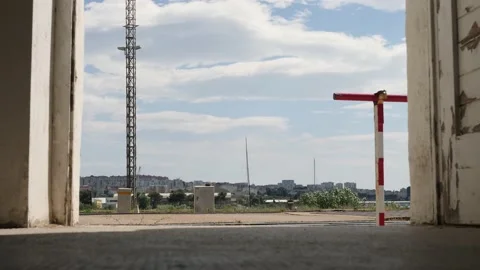 Inside Small Town Train Station, Bird Flying Across Sky, Low Angle Floor View Stock Footage 206114679