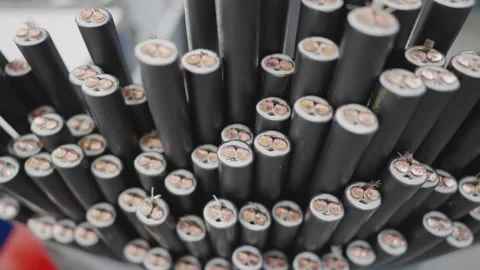 Inside structure of electrical cables, revealing copper wire elements in prod Stock Footage 308656807