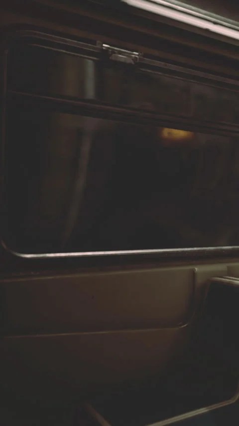 Inside a subway car, empty seats are visible, and the space is dimly lit Stock Footage 334186227
