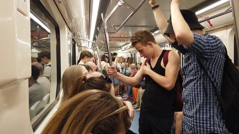 Inside the subway car. Passengers with various activities. Stock Footage 112343744