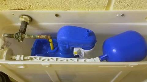 Inside a toilet cistern being flushed Stock Footage 96435130