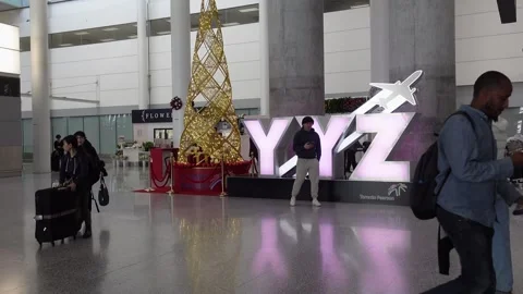Inside Toronto Pearson airport, few travellers present Stock Footage 293385825