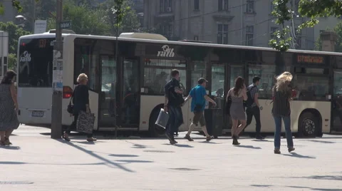 Inside town transport, bus stopped at traffic light, people walking on sidewalk Stock Footage 40009680