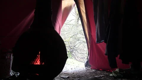 Inside a traditional Tipi with the snow falling outside in Wales Stock Footage 130349290