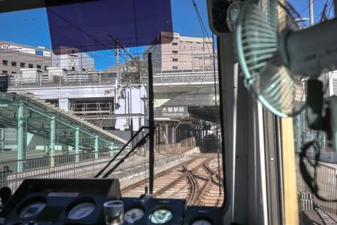 Inside a Train Cabin Overlooking Urban Railroad Tracks, Tokyo Dec 6 2024 Stock Photos