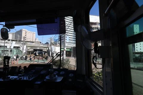 Inside a Train Cabin Overlooking Urban Railroad Tracks, Tokyo Dec 6 2024 Stock Photos