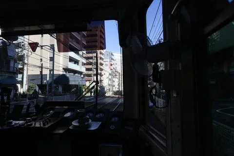 Inside a Train Cabin Overlooking Urban Railroad Tracks, Tokyo Dec 6 2024 Stock Photos