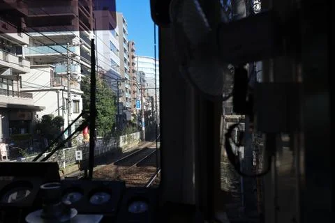 Inside a Train Cabin Overlooking Urban Railroad Tracks, Tokyo Dec 6 2024 Stock Photos