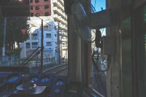 Inside a Train Cabin Overlooking Urban Railroad Tracks, Tokyo Dec 6 2024 Stock Photos