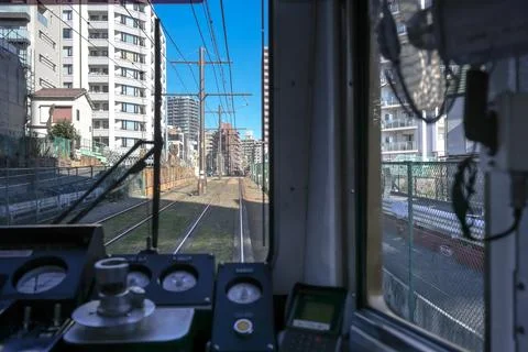 Inside a Train Cabin Overlooking Urban Railroad Tracks, Tokyo Dec 6 2024 Stock Photos