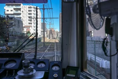 Inside a Train Cabin Overlooking Urban Railroad Tracks, Tokyo Dec 6 2024 Stock Photos