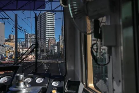 Inside a Train Cabin Overlooking Urban Railroad Tracks, Tokyo Dec 6 2024 Stock Photos