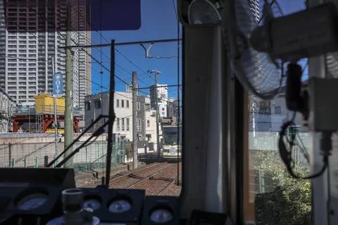 Inside a Train Cabin Overlooking Urban Railroad Tracks, Tokyo Dec 6 2024 Stock Photos