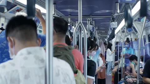 Inside train commuter BTS skytrain car while moving full with crowded passe.. Stock Footage 256377722
