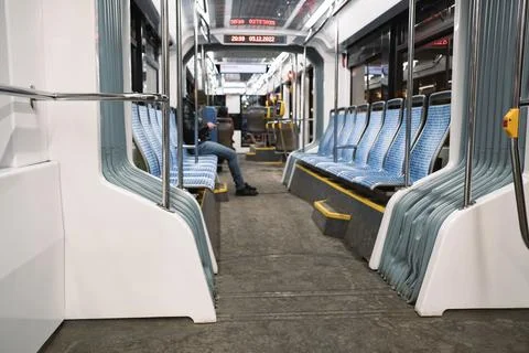 Inside the tram in the evening. One passenger Stock Photos