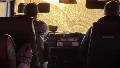 Inside A Unimog, Passengers Travel Rough Terrain As Sunlight Sweeps Across The Stock Footage 332495660