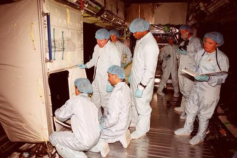 Inside the U.S. Lab, Destiny, members of the STS-98 crew work with technic... Stock Photos