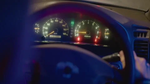 Inside vehicle with glowing neon reflections and alert indicators, Cinematic 스톡 동영상 330956516