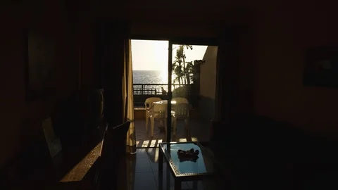 Inside View Apartment at sunset Terasse Tenerife Spain sunlight reflecting Stock Footage 104396971