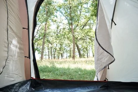 Inside view of camping tent on forest in sunny morning Stock Photos