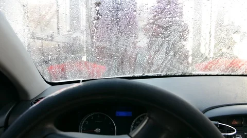 Inside view of a car being washed on an automatic machine. Car wash from inside  Видео 116565164