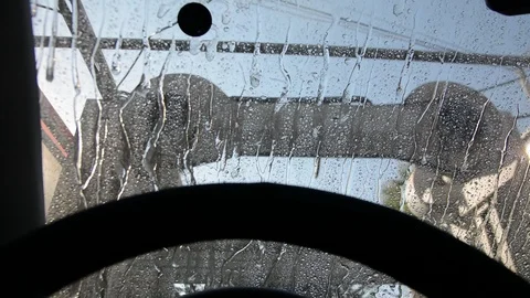 Inside view of a car being washed on an automatic machine. Car wash from inside  Stock Footage 116565290