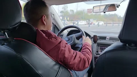 Inside view of the car pulling onto the main road. Stock Footage 329164963