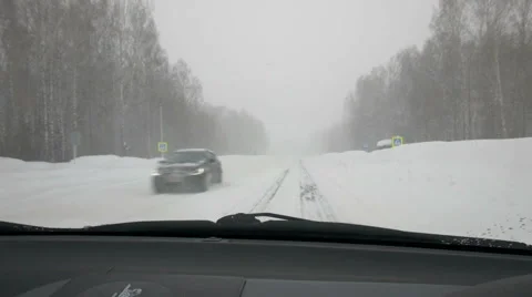 Inside view from car to winter road at blizzard. POV. Stock-Footage 47420859