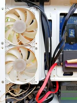 Inside View of Computer Case with Cooling Fans, Cables, and Hardware Components Stock Photos